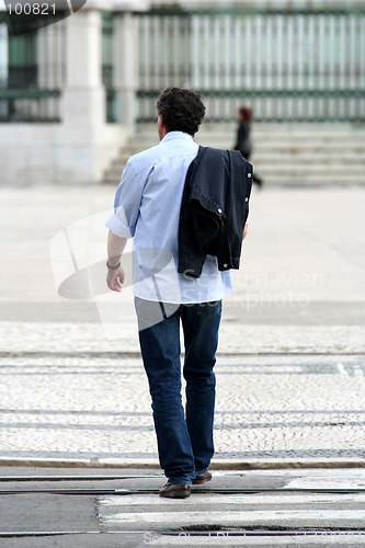 Image of Cool man walking in the street