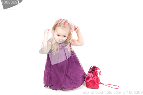 Image of Studio shot of baby girl in gala dress