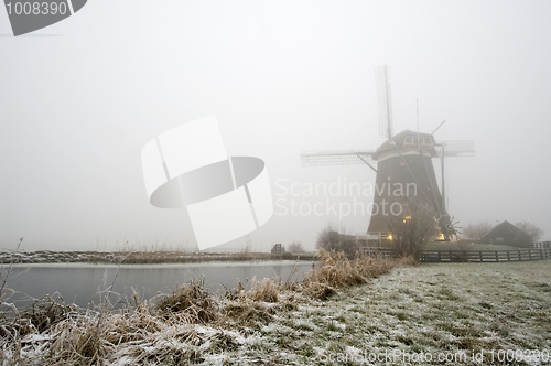 Image of Windmill on a foggy winter morning