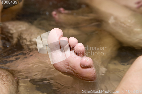 Image of Wrinkled toes in a hot tub