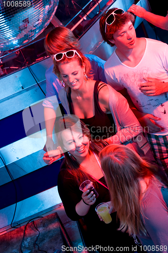 Image of Party in a nightclub viewed from the DJ booth