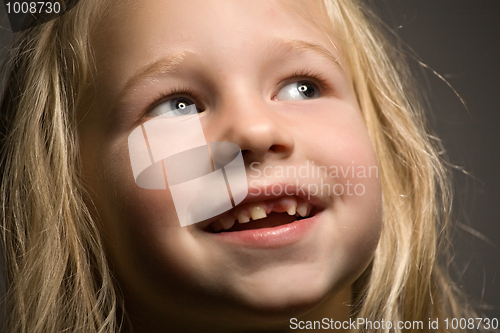 Image of little girl without one front tooth