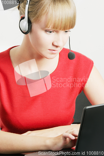 Image of Call center employee looking at laptop