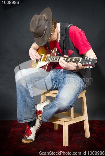 Image of Sitting Guitar player