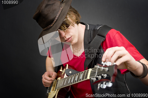 Image of Tuning a guitar