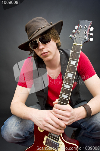 Image of Young guitar player