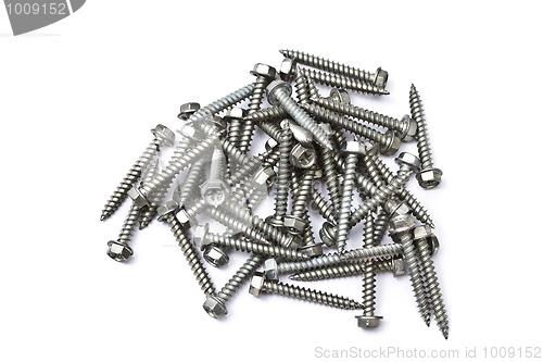 Image of Heap of screws isolated on white 