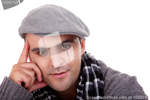 Image of Portrait of a young man , thinking , in autumn/winter clothes