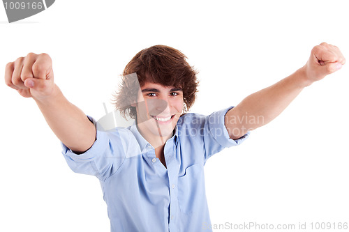 Image of Portrait of a very happy  young man with his arms raised