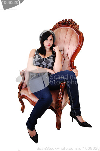 Image of Girl sitting in armchair.
