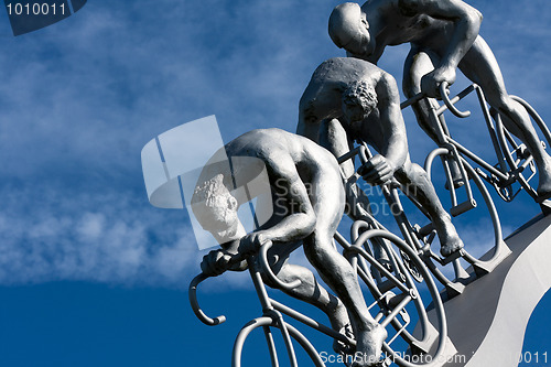 Image of Three cyclists in a slope
