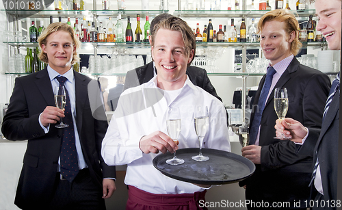 Image of waiter serving champagne