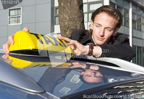 Image of Placing the Taxi sign