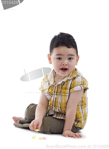 Image of cute boy with candies