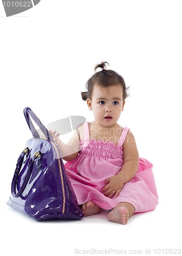 Image of cute little girl with purse