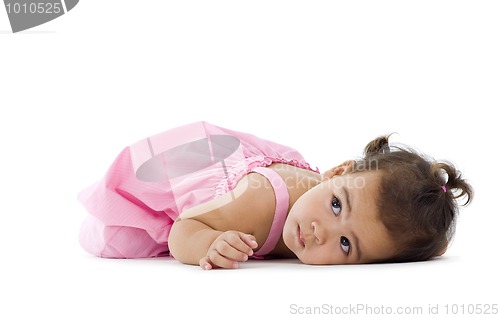 Image of little girl laying down on the floor