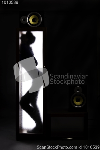 Image of A girl behind the glass door            