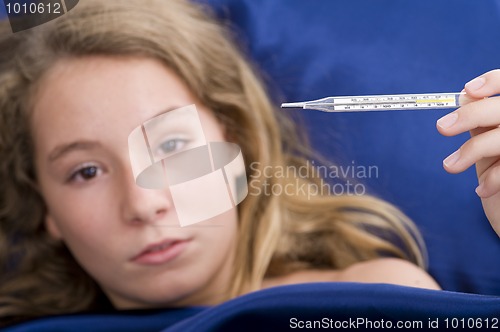 Image of girl sick in bed