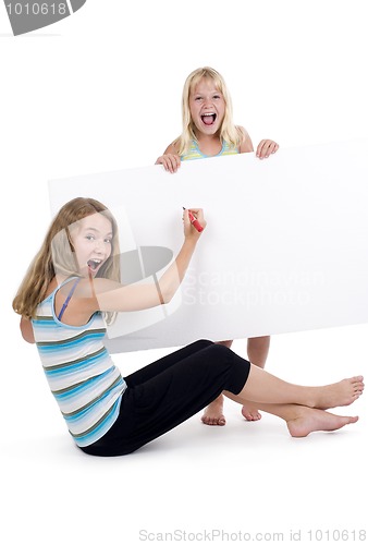 Image of blond girls with blank sign