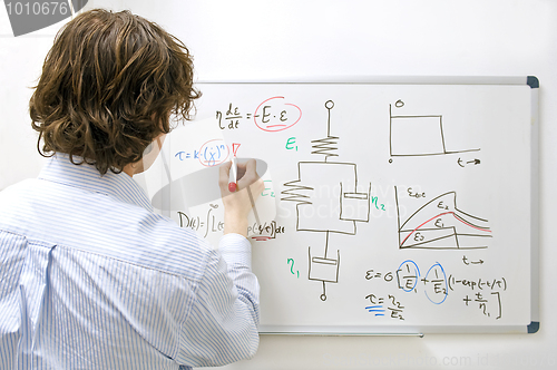 Image of Engineer at whiteboard