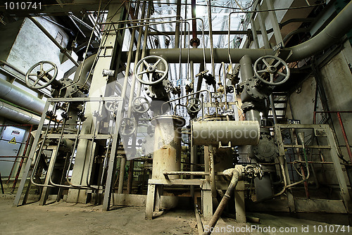 Image of Equipment, cables and piping as found inside of a modern industr