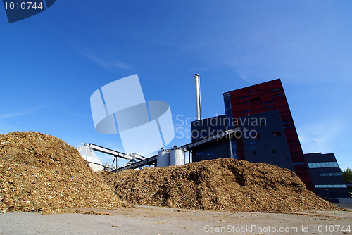 Image of Modern industrial factory against blue sky