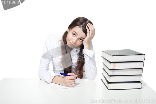 Image of Sad girl with books