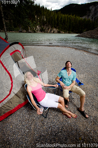 Image of Couple Relaxing while Camping