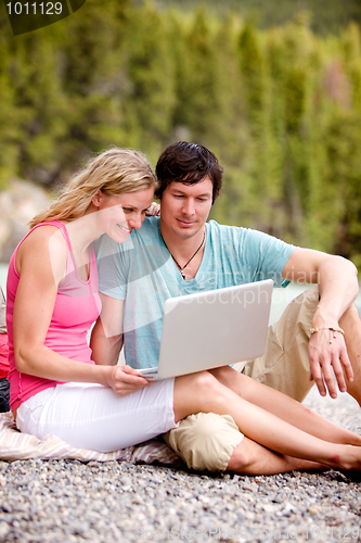 Image of Outdoor Computer Couple