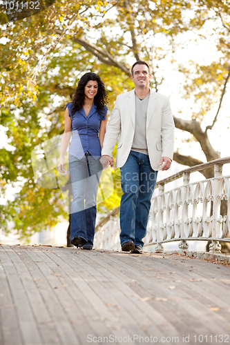 Image of Couple Walk Bridge