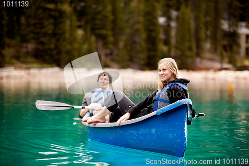 Image of Couple Relaxing in a Canoe