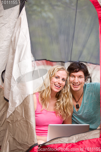 Image of Camping Couple with Laptop
