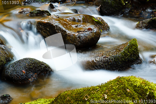 Image of Falls on the small mountain river in a wood shooted in autumn