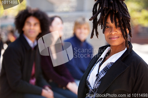 Image of Four People with One Woman as Focal Point