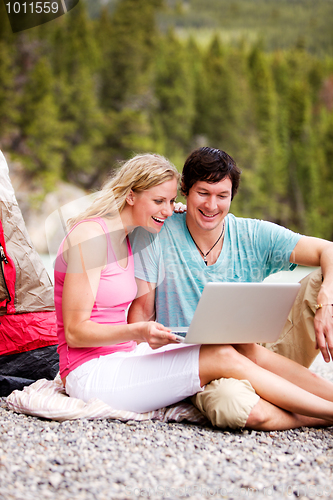 Image of Laptop Outdoor Couple Camping