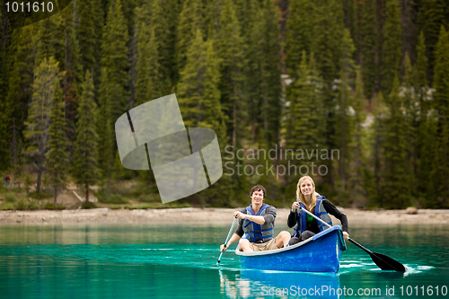 Image of Couple Portrait in Canoe