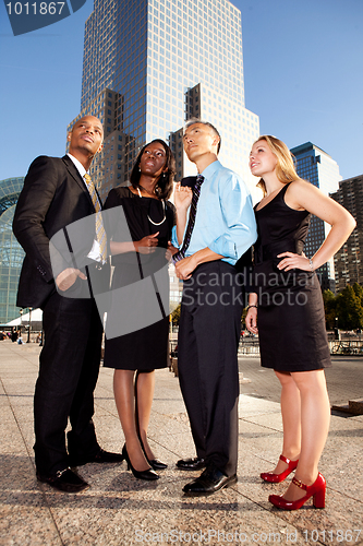 Image of Four Business People Looking Upwards