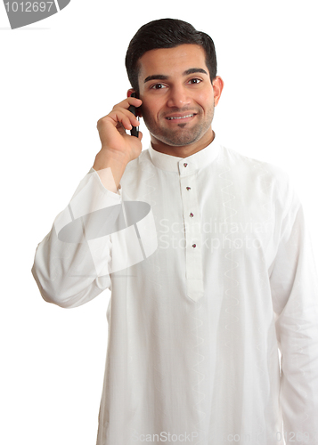 Image of Smiling man using phone