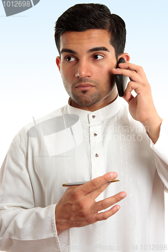 Image of Ethnic business man using phone