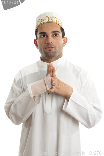 Image of Ethnic man traditional clothing thinking looking up