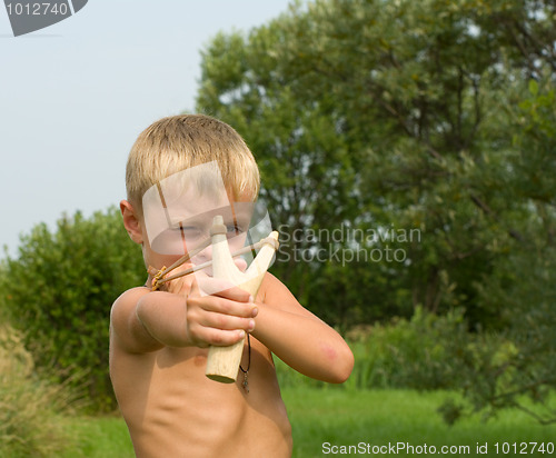 Image of Child with a slingshot.