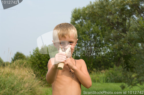 Image of Boy with a slingshot.