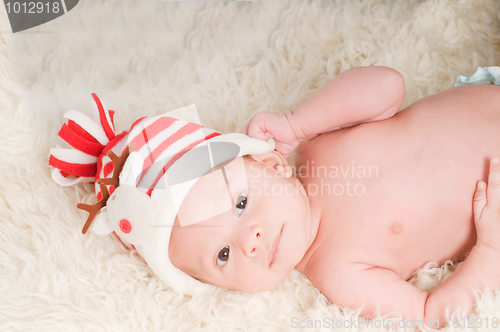 Image of Newborn baby in chritstmas hat