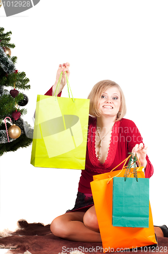 Image of Happy woman with Christmas presents