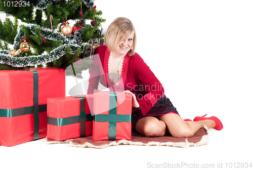 Image of Happy woman with Christmas presents