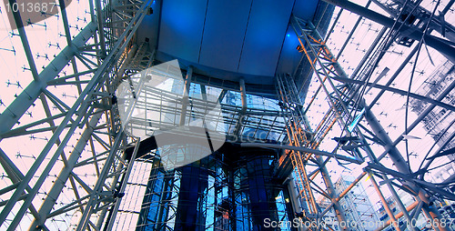 Image of multi-story glass atrium at dusk 