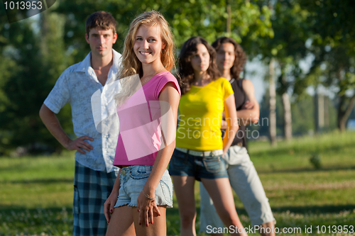 Image of The girl and her friends in the park