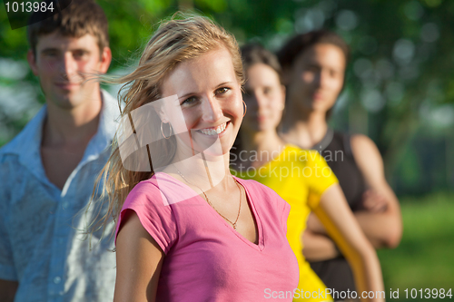 Image of The girl and her friends in the park