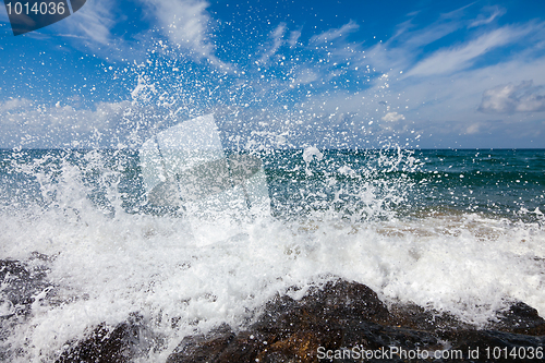 Image of The waves breaking on a stony beach