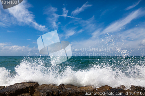 Image of The waves breaking on a stony beach